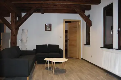 Coin salon dans l'établissement Gîte de l'ours grognon