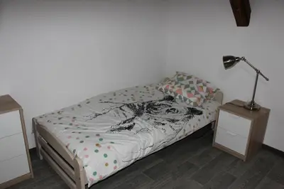 Un ou plusieurs lits dans un hébergement de l'établissement Gîte de l'ours grognon