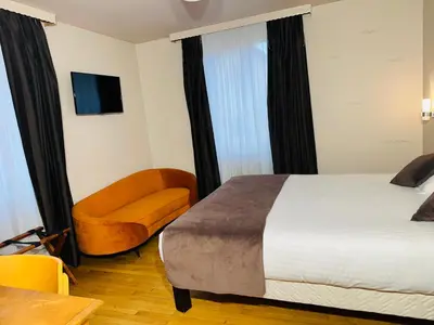 Un ou plusieurs lits dans un hébergement de l'établissement Hôtel- Restaurant Merveilles88
