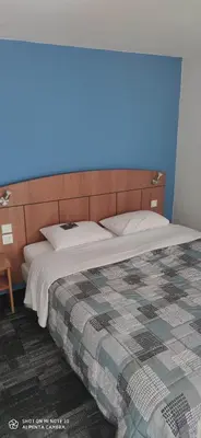 Un ou plusieurs lits dans un hébergement de l'établissement Kyriad Mulhouse Est - Lutterbach
