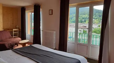 Un ou plusieurs lits dans un hébergement de l'établissement Hotel De La Route Verte