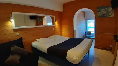 Un ou plusieurs lits dans un hébergement de l'établissement Hotel De La Route Verte