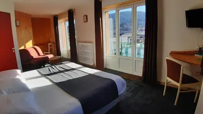 Un ou plusieurs lits dans un hébergement de l'établissement Hotel De La Route Verte