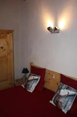 Un ou plusieurs lits dans un hébergement de l'établissement Gîte du Charri