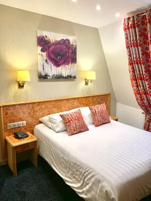 Un ou plusieurs lits dans un hébergement de l'établissement Hotel Bristol