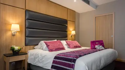Un ou plusieurs lits dans un hébergement de l'établissement Hotel Bristol