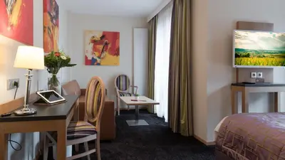 Télévision ou salle de divertissement dans l'établissement Hotel Bristol