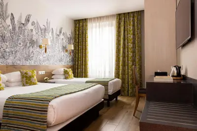 Un ou plusieurs lits dans un hébergement de l'établissement Hotel Bristol