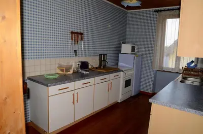 Cuisine ou kitchenette dans l'établissement Claude
