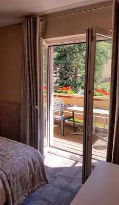 Un ou plusieurs lits dans un hébergement de l'établissement Hotel Les Remparts
