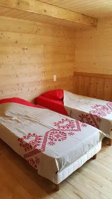 Un ou plusieurs lits dans un hébergement de l'établissement chalet des cyclistes