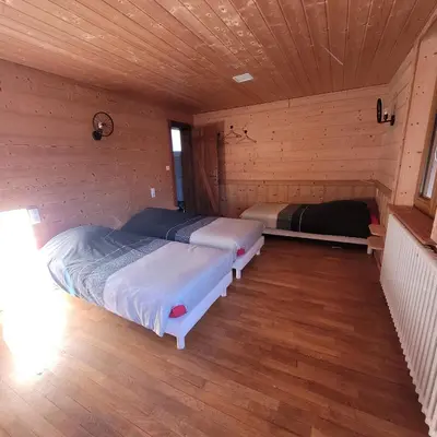 Un ou plusieurs lits dans un hébergement de l'établissement chalet des cyclistes