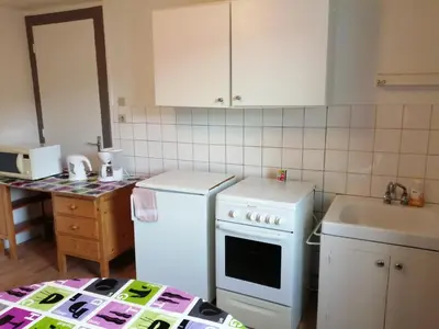 Cuisine ou kitchenette dans l'établissement Mamyvonne Vacances