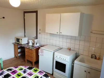 Cuisine ou kitchenette dans l'établissement Mamyvonne Vacances