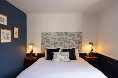 Un ou plusieurs lits dans un hébergement de l'établissement L'Auberge du Brand
