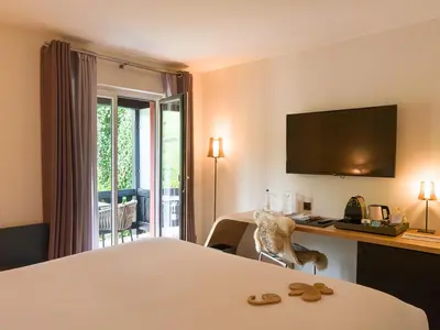 Télévision ou salle de divertissement dans l'établissement Relais et Châteaux Le Chambard