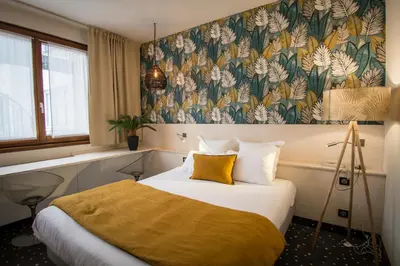 Un ou plusieurs lits dans un hébergement de l'établissement Hôtel Restaurant Vaillant proche Europapark