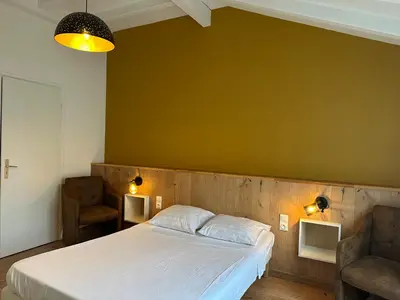 Un ou plusieurs lits dans un hébergement de l'établissement Hotel Porte de France - Self Check In by Homenhancement