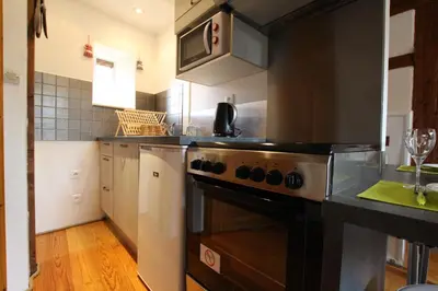 Cuisine ou kitchenette dans l'établissement Gîte Par ci, Par là