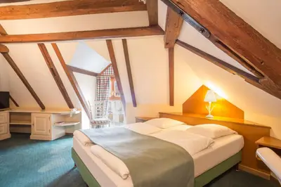 Un ou plusieurs lits dans un hébergement de l'établissement Hostellerie Schwendi