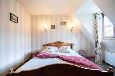 Un ou plusieurs lits dans un hébergement de l'établissement Hôtel Berceau Du Vigneron