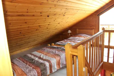Un ou plusieurs lits dans un hébergement de l'établissement chalets de la Soyotte