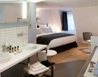 Un ou plusieurs lits dans un hébergement de l'établissement Hôtel Quatorze
