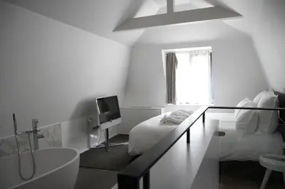 Un ou plusieurs lits dans un hébergement de l'établissement Hôtel Quatorze