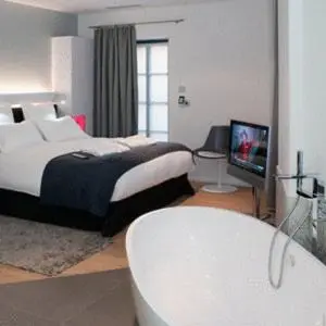 Un ou plusieurs lits dans un hébergement de l'établissement Hôtel Quatorze