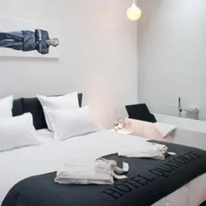 Un ou plusieurs lits dans un hébergement de l'établissement Hôtel Quatorze