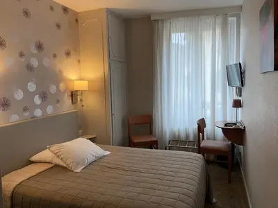 Un ou plusieurs lits dans un hébergement de l'établissement Hôtel Bar Des Vosges