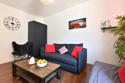 Coin salon dans l'établissement Appartement Les Cigognes du Centre