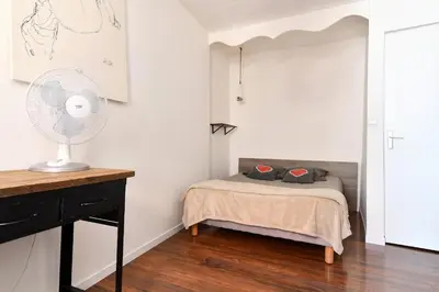 Un ou plusieurs lits dans un hébergement de l'établissement Appartement Les Cigognes du Centre