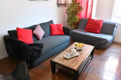 Coin salon dans l'établissement Appartement Les Cigognes du Centre