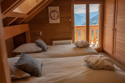 Un ou plusieurs lits dans un hébergement de l'établissement La Cabane de Tim