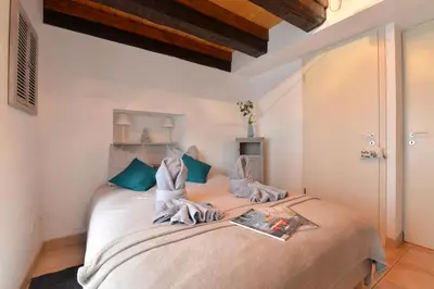 Un ou plusieurs lits dans un hébergement de l'établissement Appartement Le cosy de la Petite Venise