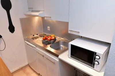 Cuisine ou kitchenette dans l'établissement Appartement Le cosy de la Petite Venise