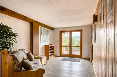 Coin salon dans l'établissement Gîte Les 4 Saisons