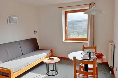 Coin salon dans l'établissement Gîte Les 4 Saisons