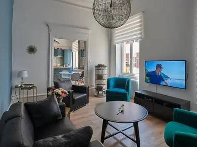 Télévision ou salle de divertissement dans l'établissement Les Appartements Saint-Martin
