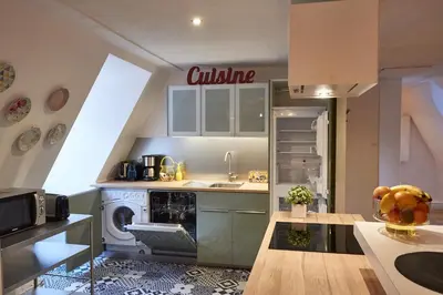 Cuisine ou kitchenette dans l'établissement Les Appartements Saint-Martin