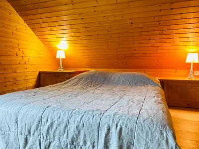 Un ou plusieurs lits dans un hébergement de l'établissement Chalet Brimbelle