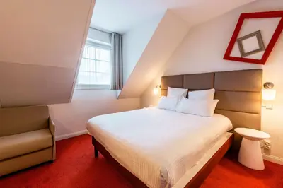 Un ou plusieurs lits dans un hébergement de l'établissement Best Western Plus Au cheval Blanc à Mulhouse