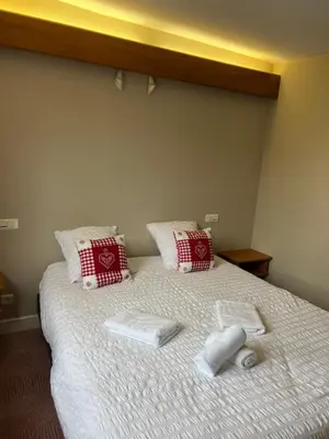 Un ou plusieurs lits dans un hébergement de l'établissement Hôtel Restaurant Valneige