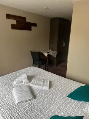 Un ou plusieurs lits dans un hébergement de l'établissement Hôtel Restaurant Valneige