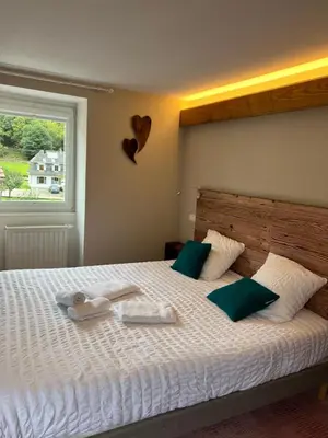 Un ou plusieurs lits dans un hébergement de l'établissement Hôtel Restaurant Valneige