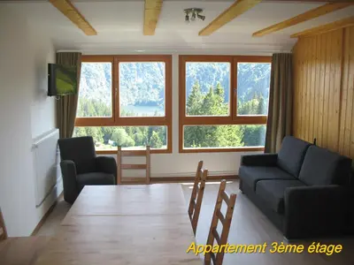 Coin salon dans l'établissement Les Terrasses du Lac Blanc - Studios & Appartements