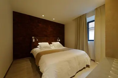 Un ou plusieurs lits dans un hébergement de l'établissement The One Apartments