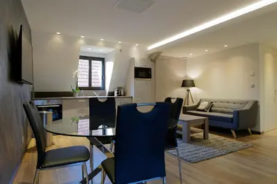 Télévision ou salle de divertissement dans l'établissement The One Apartments