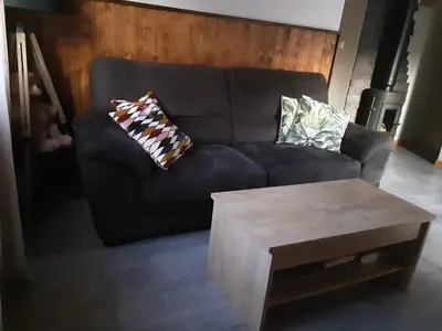 Coin salon dans l'établissement Chalet la Petite Perle